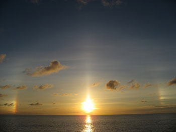 A �sunbow,� a rainbow without the rain, was the show of the night.  Note the large arc of light around the sun.